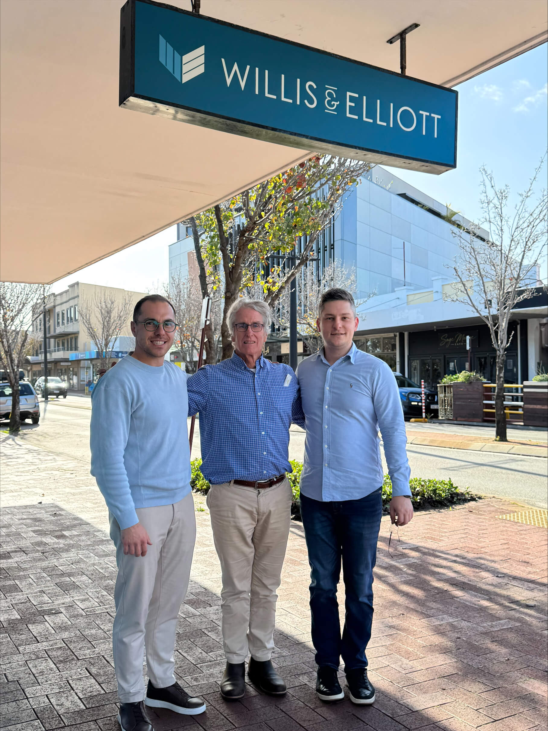 Marjan and Yani Lazarev with Bruce Willis outside the Willis & Elliott practice